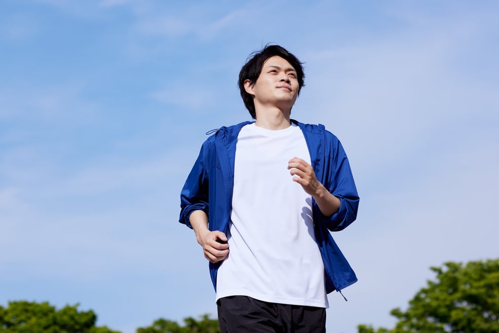 Man Jogging Outdoors in Athletic Wear